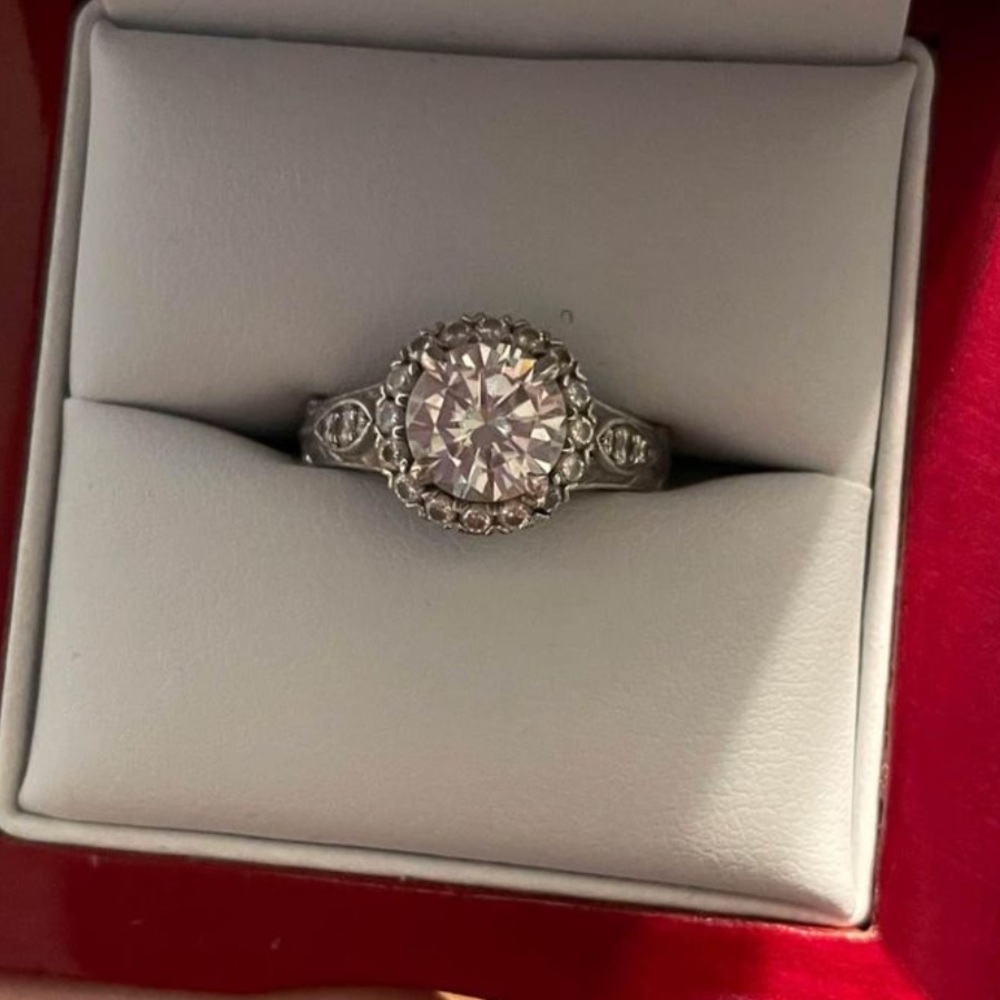 Engagement ring. 
White gold 
All diamonds around ring, moissanite center $500